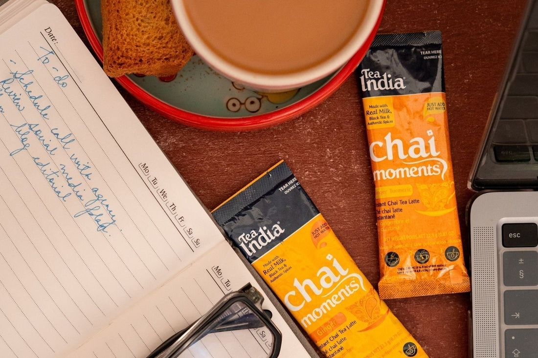 Tea India Masala Chai Moments alongside a diary and a laptop