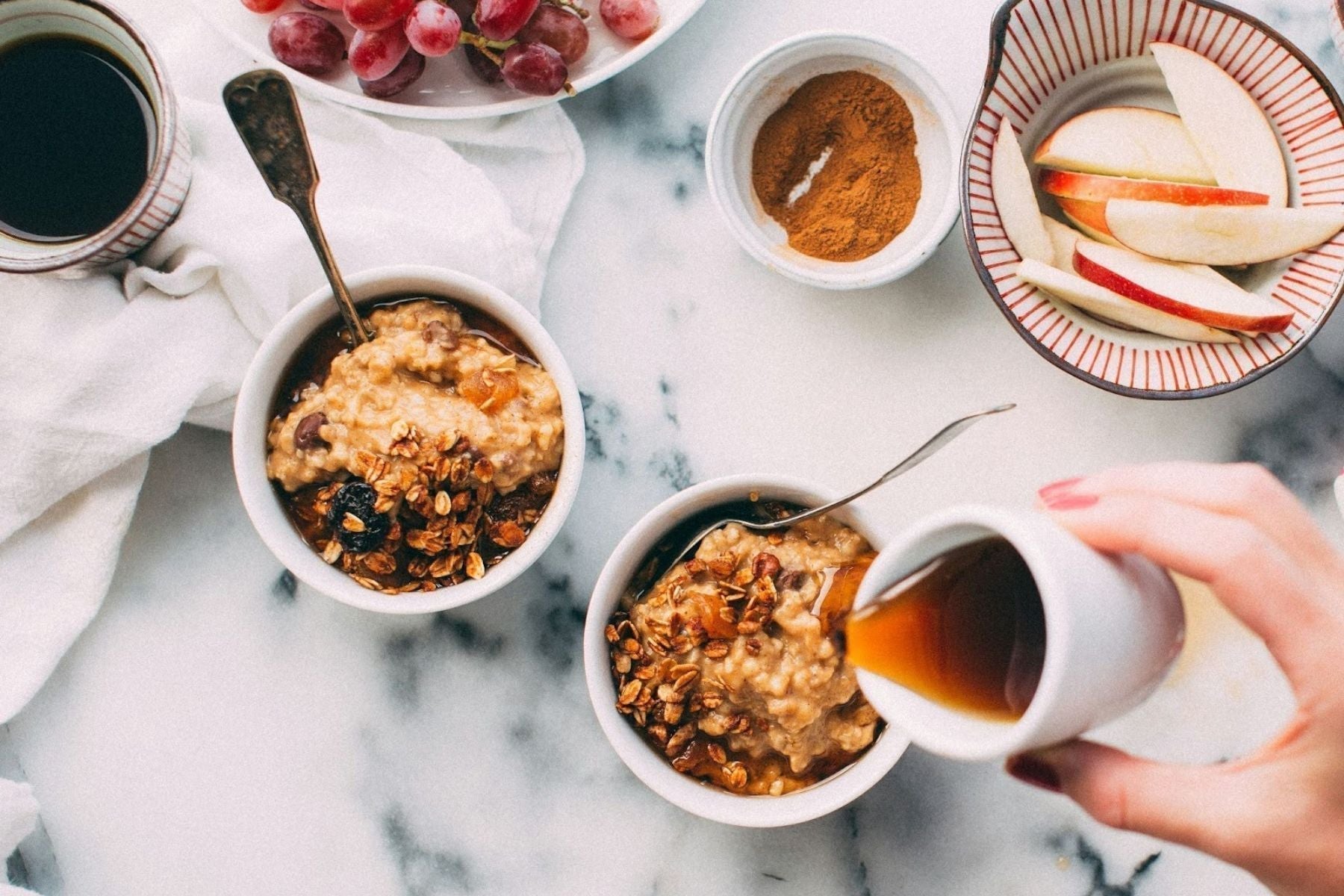 Honey being poured into Cinnamon Oats