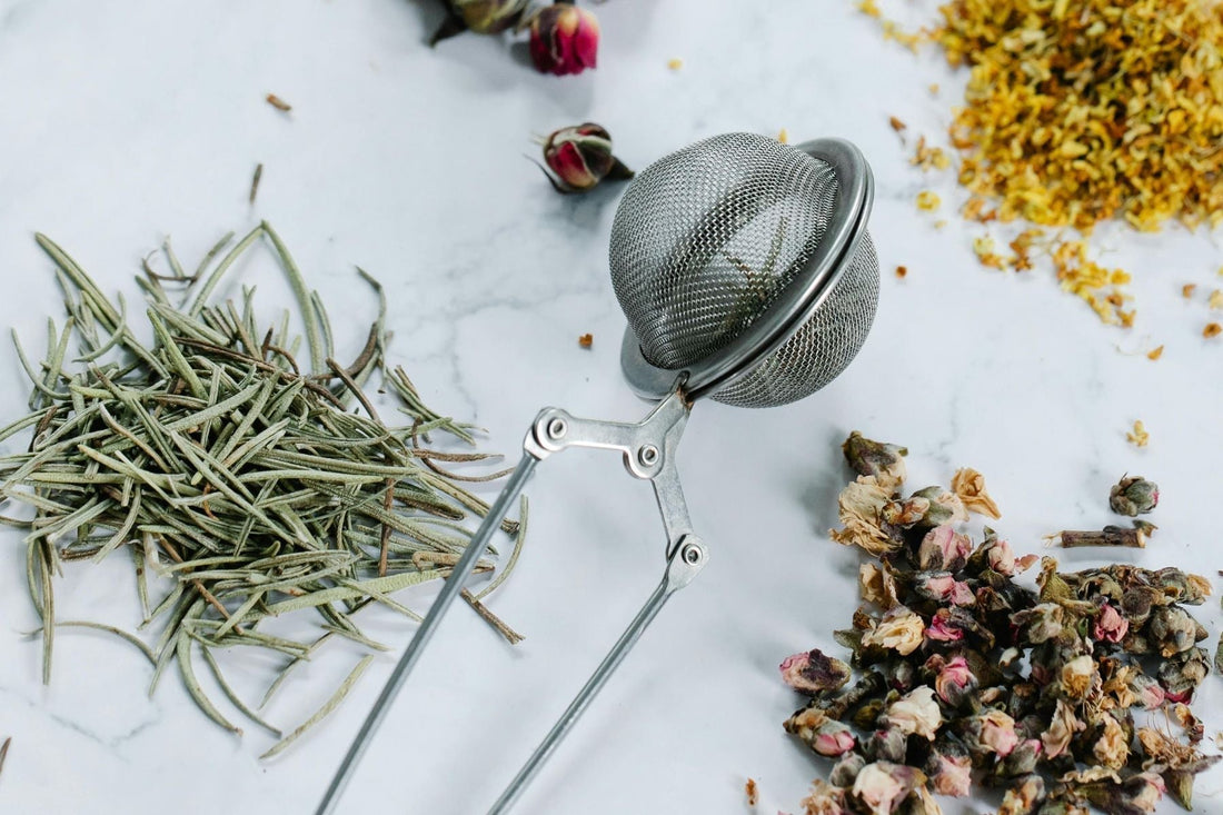 Tea Strainer surrounded by different spices