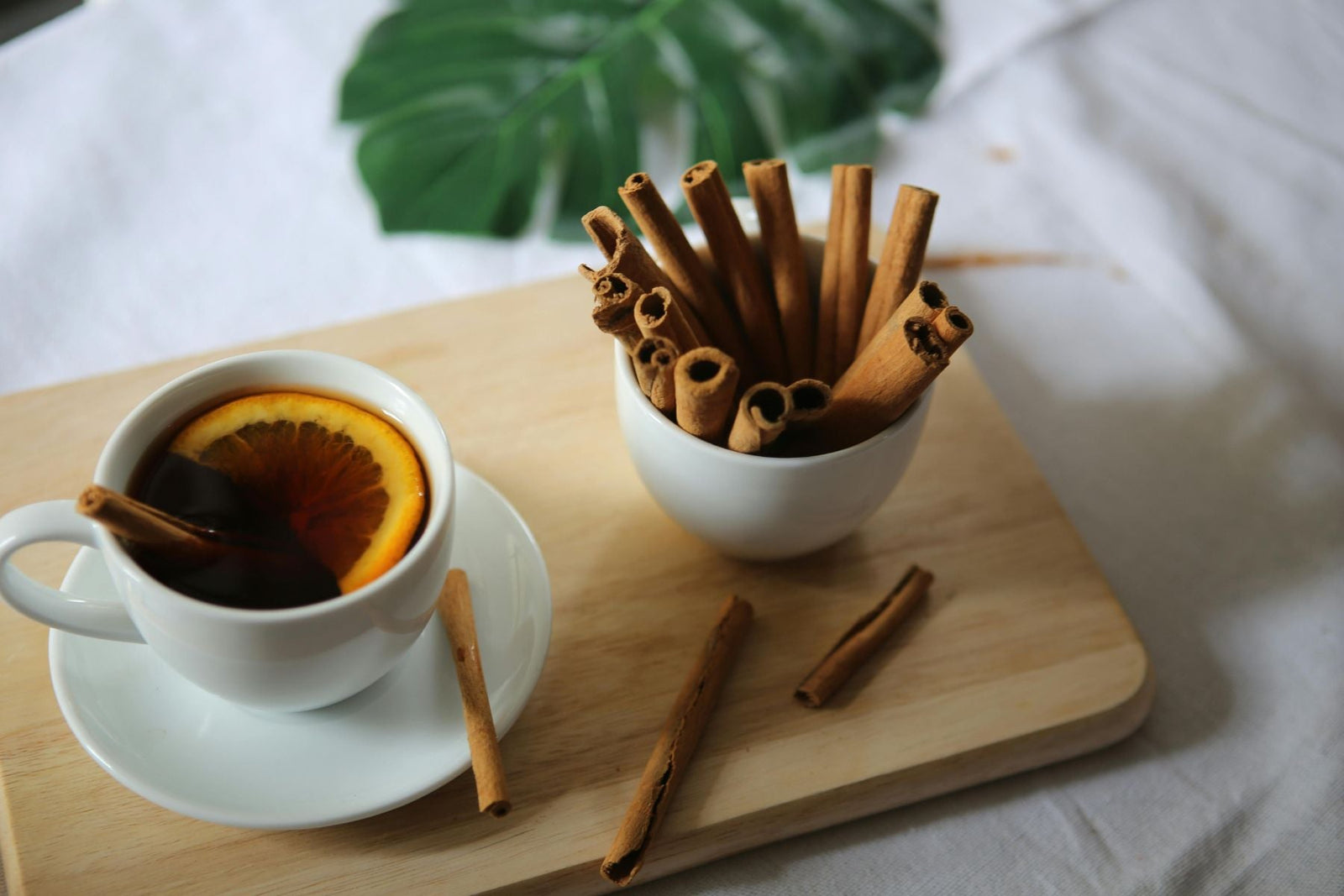 Orange Pekoe Tea with a slice of orange and a cinnamon stick