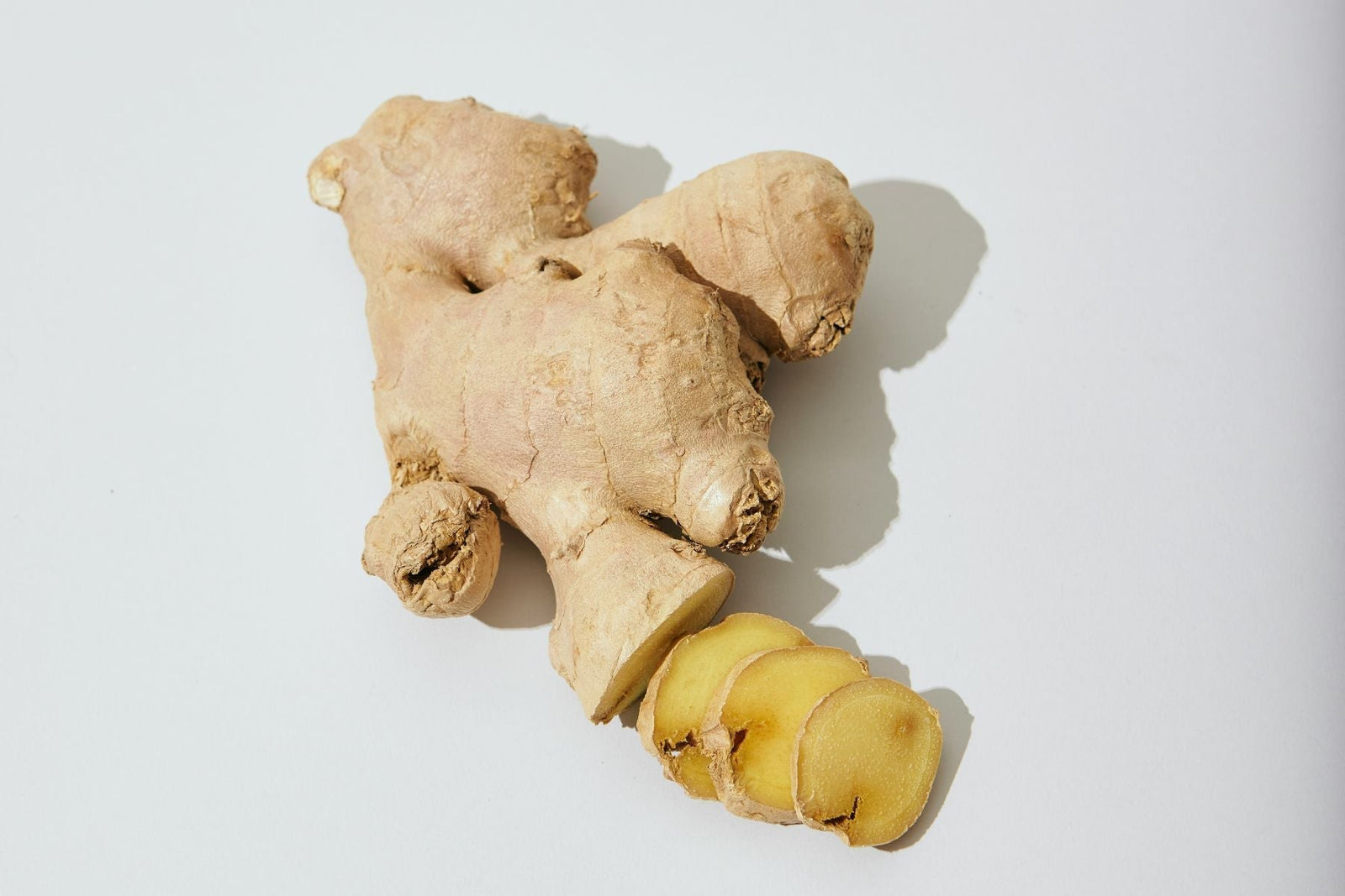 Fresh ginger root with a few slices