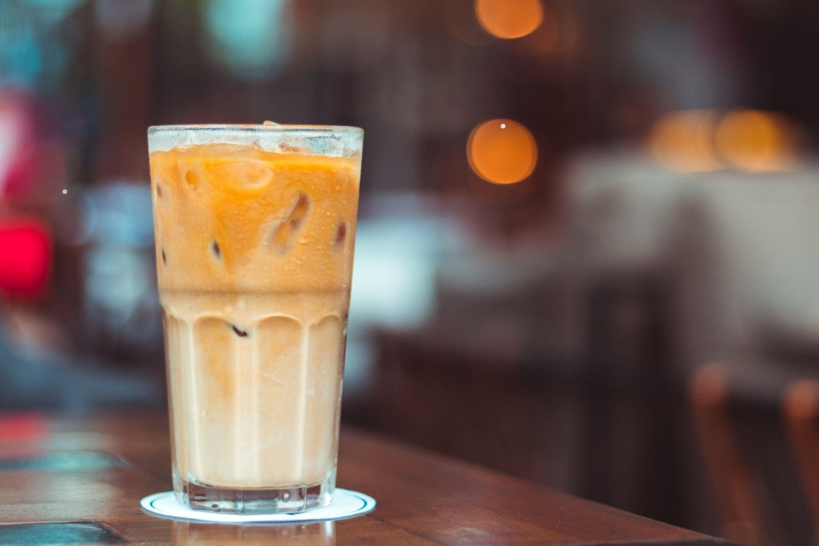 Glass of Vanilla layered iced tea on a table