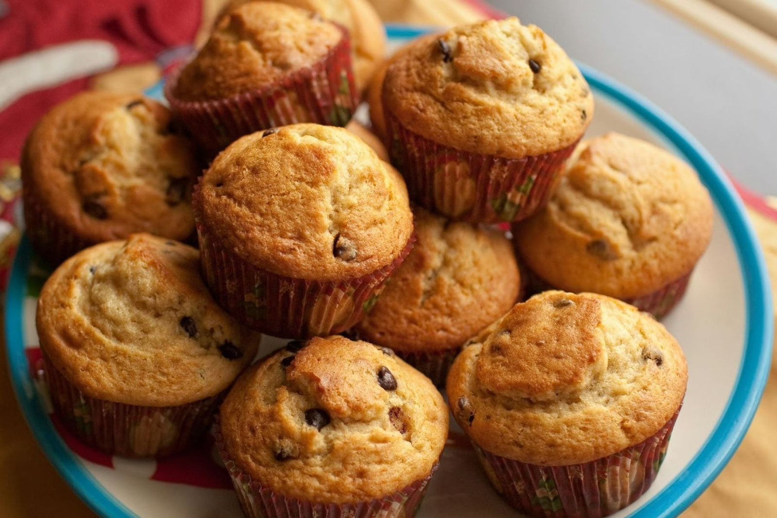 Stack of fresh muffins on a plate.