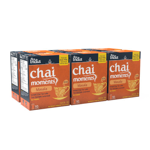 Six boxes of Tea India Chai Moments Masala instant chai tea latte, showing the product packaging in a multipack
