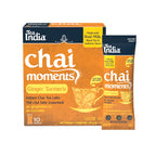 Box and  individual serving sachet of Tea India Chai Moments Ginger Turmeric on a white background