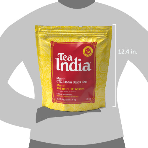 Tea India package held by a person, showing size reference.