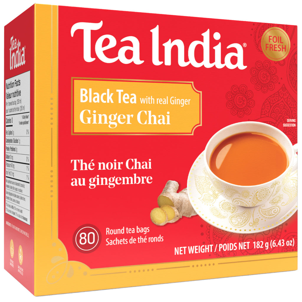 Box of Tea India Ginger Chai black tea with a cup and ginger pieces on a red background on the packaging