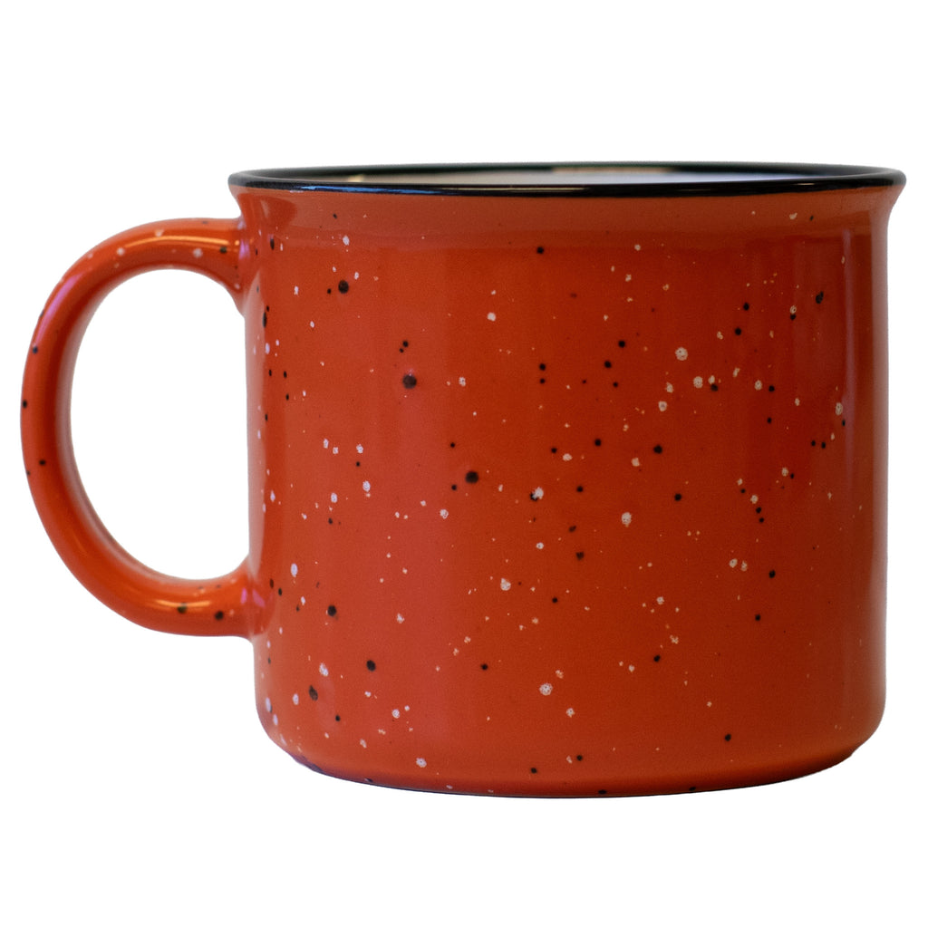 an orange campfire mug with a large handle on a white background