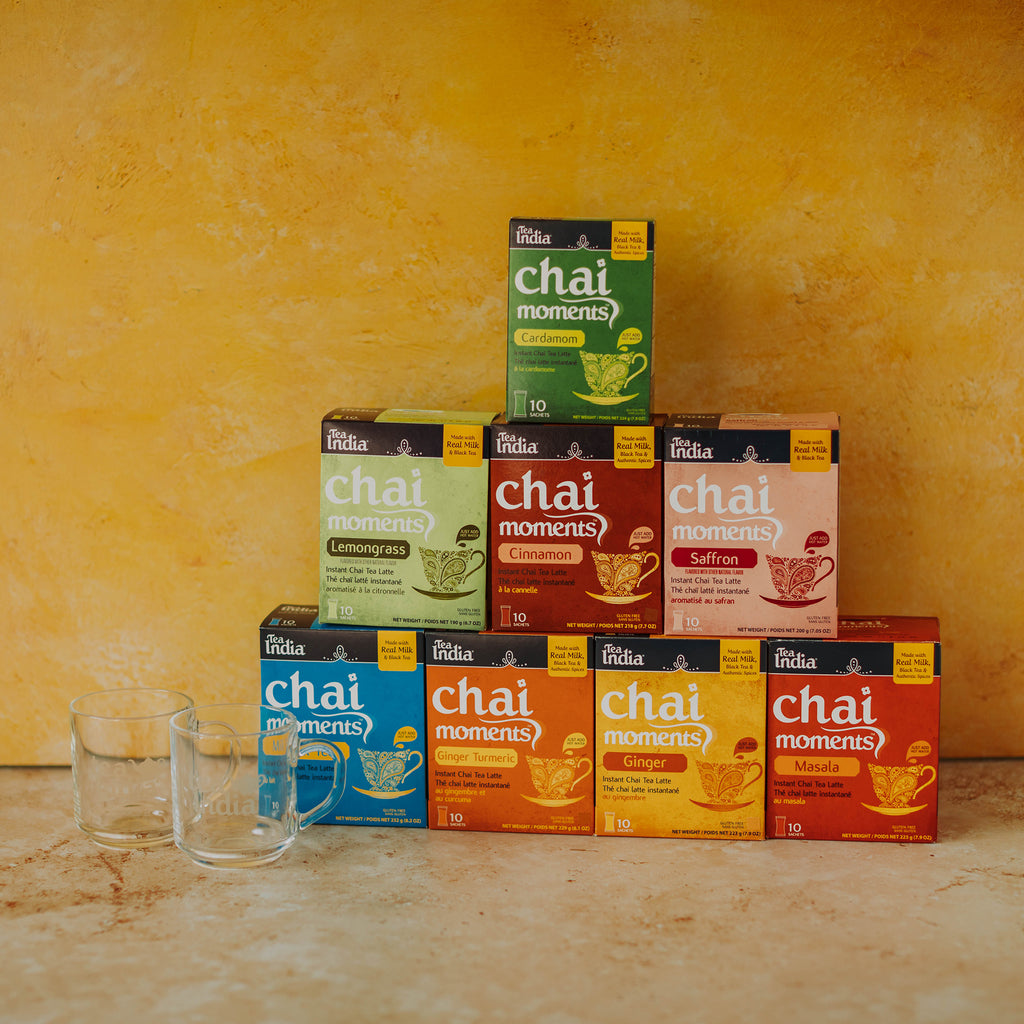 Stack of 'chai moments' tea boxes with a yellow background