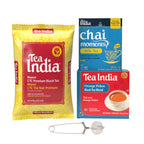 Tea India tea product assortment on a white background, including a large yellow and red Mamri CTC Premium Black Tea bag, a blue Chai Moments Milk Tea box, a red and blue Orange Pekoe Black Tea Blend box, and a metal tea infuser with a ball filter.