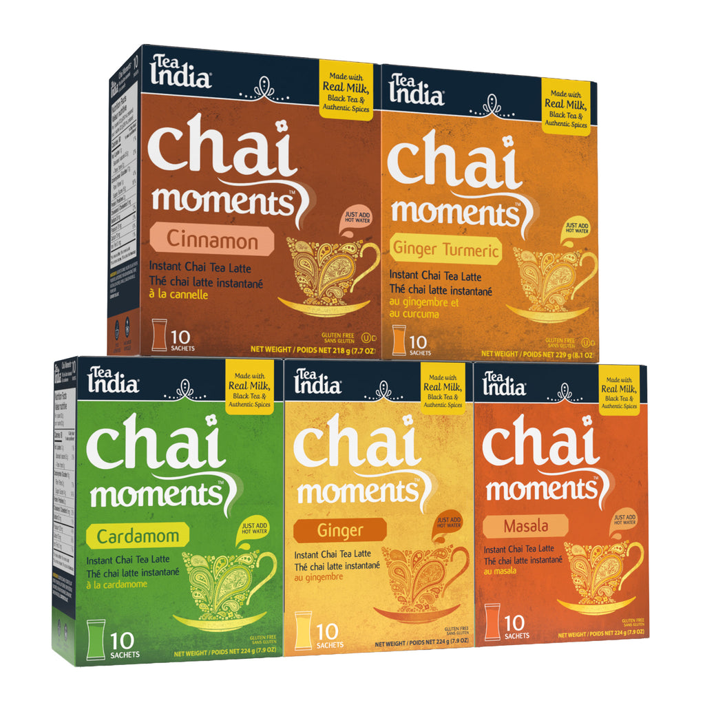 Tea India Chai Moments instant chai tea latte packages in various flavors on a white background.