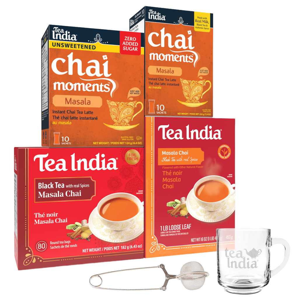 Tea India chai and black tea products with a glass mug and tea strainer on a white background