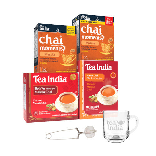 Tea India masala chai moments and masala black tea boxes with a cup of tea and a tea infuser on a white background