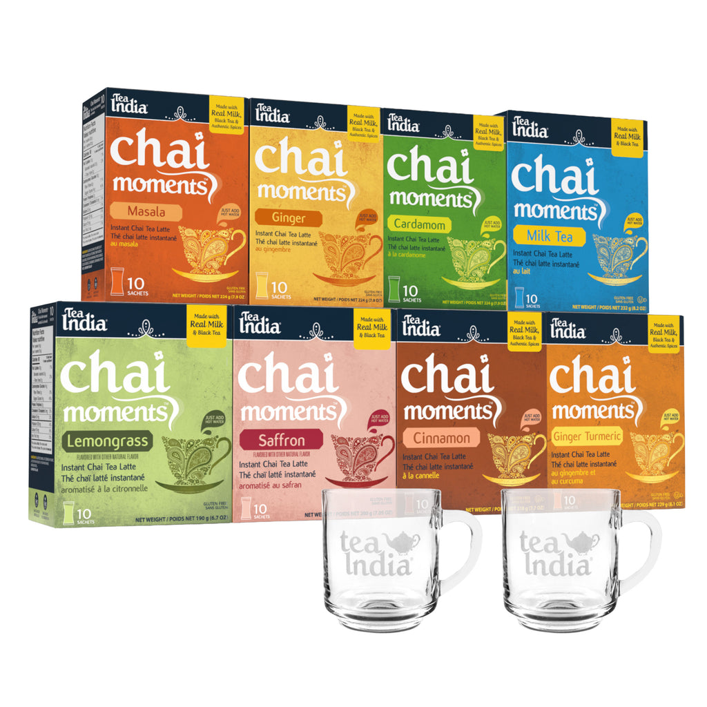 8 Assorted boxes of Chai Moments instant chai latte tea from Tea India with two clear mugs in front.