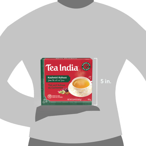 A person holds a red and green box of Tea India Kashmiri Kahwa green tea, showing its 5-inch height dimension