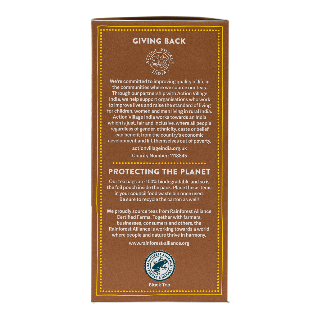 The back of a tea box package shown on a plain white background. The box is brown with gold border lines and text, featuring donation and environmental messaging, and a circular logo at the bottom that reads Rainforest Alliance Certified Fairtrade Organic.