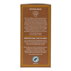 The back of a tea box package shown on a plain white background. The box is brown with gold border lines and text, featuring donation and environmental messaging, and a circular logo at the bottom that reads Rainforest Alliance Certified Fairtrade Organic.