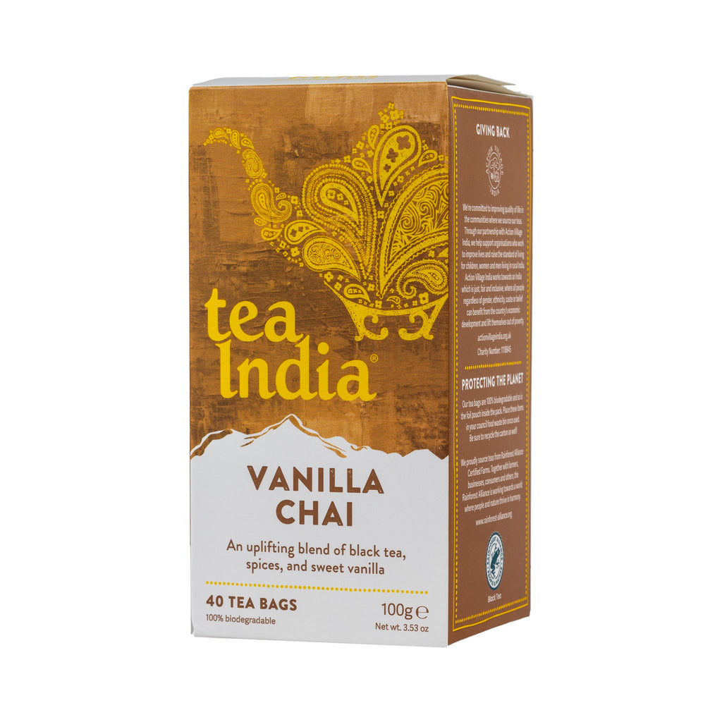 A box of Tea India Vanilla Chai tea bags, featuring a warm brown and gold design with a white lower section, shown on a plain white background.