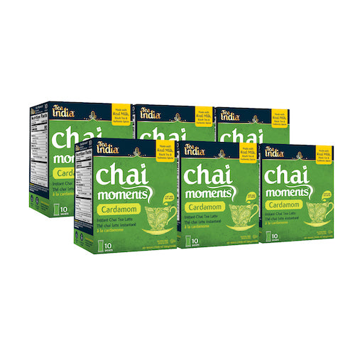Five boxes of Tea India cardamom chai moments instant latte, each with 10 sachets, arranged in a grouped display
