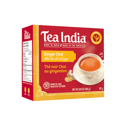 A red and yellow box of Tea India Ginger Chai Black Tea, showing 80 round tea bags and a cup of chai.