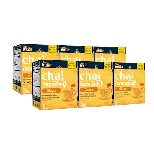 Five boxes of Tea India ginger chai moments instant latte, each with 10 sachets, displayed in a staggered row
