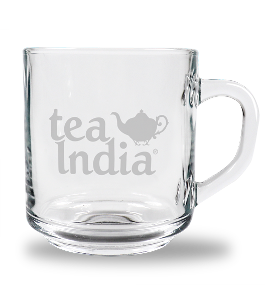Clear glass mug with a handle, featuring the Tea India logo and a small teapot graphic on the side